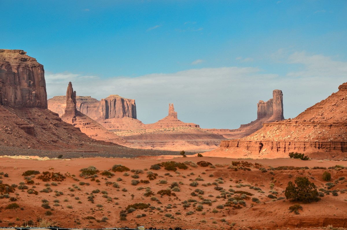 Warm desert canyon landscape beneath a blue sky